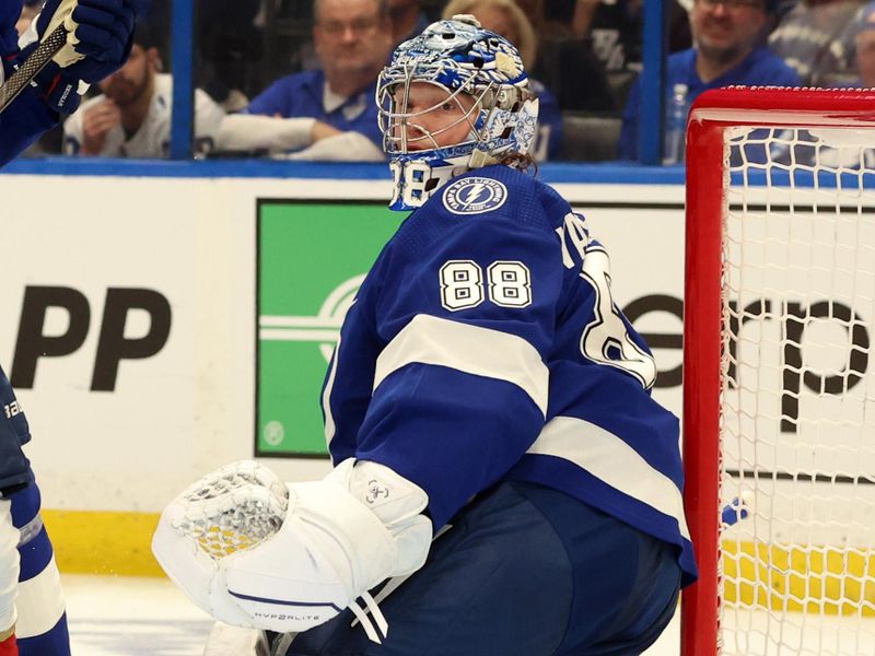 Apr 25, 2024; Tampa, Florida, USA; Tampa Bay Lightning goaltender Andrei Vasilevskiy (88) looks on against the Florida Panthers during the second period in game three of the first round of the 2024 Stanley Cup Playoffs at Amalie Arena. Mandatory Credit: Kim Klement Neitzel-USA TODAY Sports