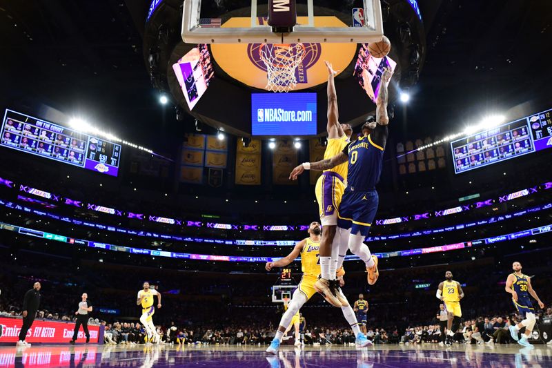 LOS ANGELES, CA - APRIL 9: Gary Payton II #0 of the Golden State Warriors drives to the basket during the game against the Los Angeles Lakers on April 9, 2024 at Crypto.Com Arena in Los Angeles, California. NOTE TO USER: User expressly acknowledges and agrees that, by downloading and/or using this Photograph, user is consenting to the terms and conditions of the Getty Images License Agreement. Mandatory Copyright Notice: Copyright 2024 NBAE (Photo by Adam Pantozzi/NBAE via Getty Images)