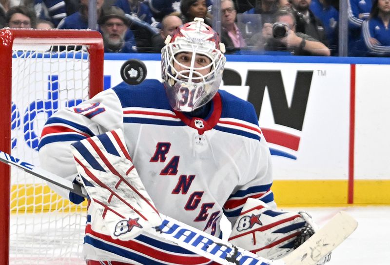 Mar 2, 2024; Toronto, Ontario, CAN; New York Rangers goalie Igor Shesterkin (31) watches the puck after making a save against the Toronto Maple Leafs in the third period at Scotiabank Arena. Mandatory Credit: Dan Hamilton-USA TODAY Sports