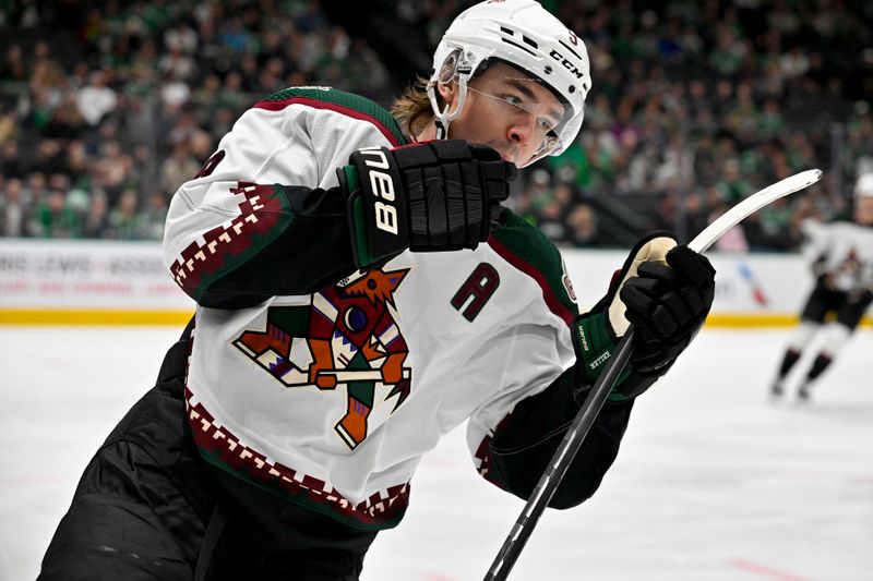 Nov 14, 2023; Dallas, Texas, USA; Arizona Coyotes right wing Clayton Keller (9) celebrates after he scores a goal against the Dallas Stars during the first period at the American Airlines Center. Mandatory Credit: Jerome Miron-USA TODAY Sports