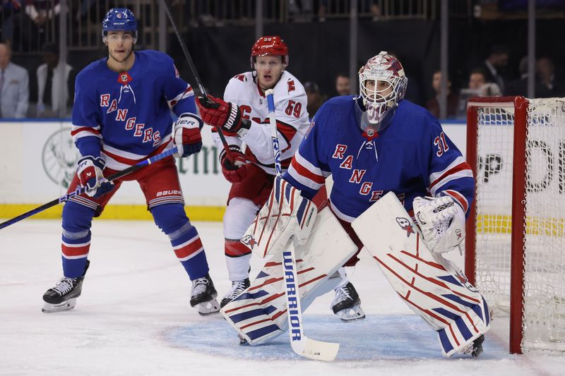 May 13, 2024; New York, New York, USA; New York Rangers goaltender Igor Shesterkin (31) tends net against the Carolina Hurricanes during the first period of game five of the second round of the 2024 Stanley Cup Playoffs at Madison Square Garden. Mandatory Credit: Brad Penner-USA TODAY Sports