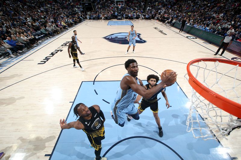 MEMPHIS, TN - MARCH 18: Jaren Jackson Jr. #13 of the Memphis Grizzlies drives to the basket during the game against the Golden State Warriors on March 18, 2023 at FedExForum in Memphis, Tennessee. NOTE TO USER: User expressly acknowledges and agrees that, by downloading and or using this photograph, User is consenting to the terms and conditions of the Getty Images License Agreement. Mandatory Copyright Notice: Copyright 2023 NBAE (Photo by Joe Murphy/NBAE via Getty Images)