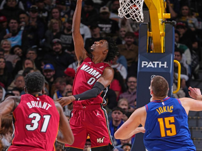 DENVER, CO - NOVEMBER 8: Josh Richardson #0 of the Miami Heat drives to the basket during the game against the Denver Nuggets on November 8, 2024 at Ball Arena in Denver, Colorado. NOTE TO USER: User expressly acknowledges and agrees that, by downloading and/or using this Photograph, user is consenting to the terms and conditions of the Getty Images License Agreement. Mandatory Copyright Notice: Copyright 2024 NBAE (Photo by Garrett Ellwood/NBAE via Getty Images)