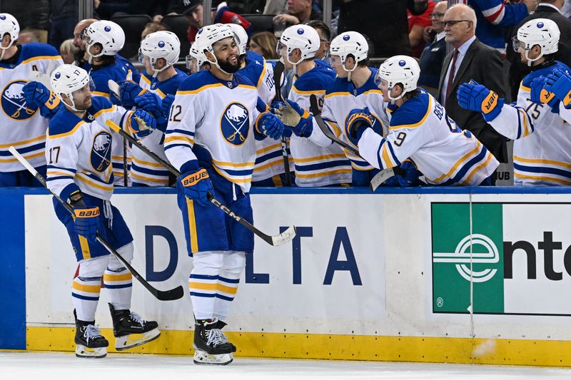 Nov 7, 2024; New York, New York, USA;  Buffalo Sabres left wing Jordan Greenway (12) celebrates his goal against the New York Rangers during the second period at Madison Square Garden. Mandatory Credit: Dennis Schneidler-Imagn Images