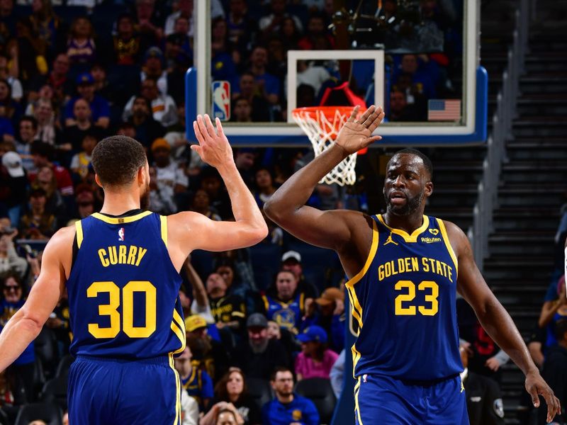 SAN FRANCISCO, CA - JANUARY 27:  Draymond Green #23 high fives Stephen Curry #30 of the Golden State Warriors during the game against the Los Angeles Lakers on January 27, 2024 at Chase Center in San Francisco, California. NOTE TO USER: User expressly acknowledges and agrees that, by downloading and or using this photograph, user is consenting to the terms and conditions of Getty Images License Agreement. Mandatory Copyright Notice: Copyright 2024 NBAE (Photo by Barry Gossage/NBAE via Getty Images)