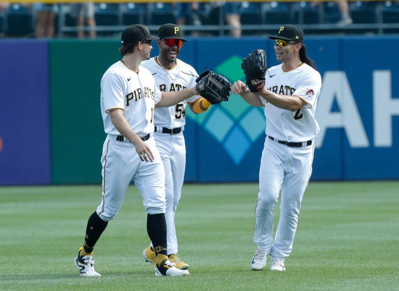 Sep 6, 2023; Pittsburgh, Pennsylvania, USA;  Pittsburgh Pirates Pittsburgh Pirates left fielder Bryan Reynolds (left) and center fielder Joshua Palacios (54) and right fielder Connor Joe (2) celebrate after defeating the Milwaukee Brewers at PNC Park. Pittsburgh won 5-4. Mandatory Credit: Charles LeClaire-USA TODAY Sports