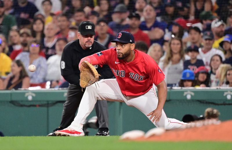 Jun 28, 2024; Boston, Massachusetts, USA; Boston Red Sox first baseman Dominic Smith (2) makes a put out during the sixth inning against the San Diego Padres  at Fenway Park. Mandatory Credit: Eric Canha-USA TODAY Sports