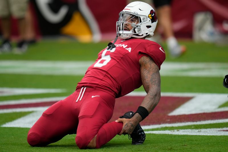 Arizona Cardinals running back James Conner (6) warms up before an NFL football game against the Dallas Cowboys, Sunday, Sept. 24, 2023, in Glendale, Ariz. (AP Photo/Ross D. Franklin)