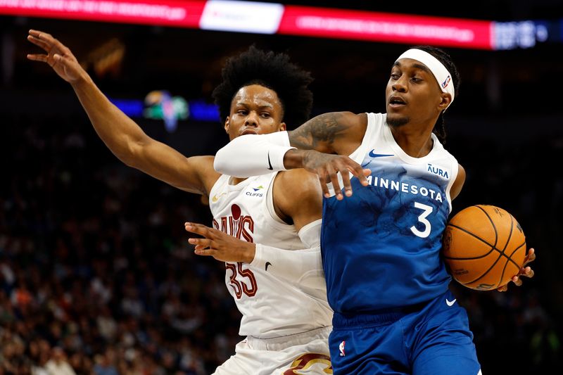 MINNEAPOLIS, MINNESOTA - MARCH 22: Jaden McDaniels #3 of the Minnesota Timberwolves drives to the basket against Isaac Okoro #35 of the Cleveland Cavaliers in the first quarter at Target Center on March 22, 2024 in Minneapolis, Minnesota. NOTE TO USER: User expressly acknowledges and agrees that, by downloading and or using this photograph, User is consenting to the terms and conditions of the Getty Images License Agreement. (Photo by David Berding/Getty Images)