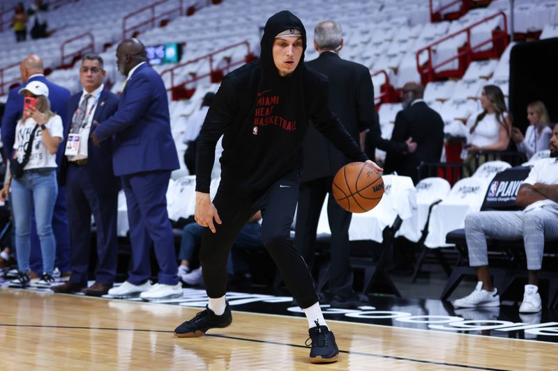 MIAMI, FLORIDA - APRIL 27: Tyler Herro #14 of the Miami Heat warms up prior to playing the Boston Celtics in game three of the Eastern Conference First Round Playoffs at Kaseya Center on April 27, 2024 in Miami, Florida.  NOTE TO USER: User expressly acknowledges and agrees that, by downloading and or using this photograph, User is consenting to the terms and conditions of the Getty Images License Agreement. (Photo by Megan Briggs/Getty Images)