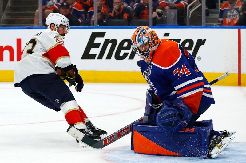 Jun 6, 2025; Edmonton, Alberta, CAN; Florida Panthers center Brad Marchand (63) shoots the puck on Edmonton Oilers goaltender Stuart Skinner (74) during the first period in game two of the 2025 Stanley Cup Final at Rogers Place. Mandatory Credit: Perry Nelson-Imagn Images