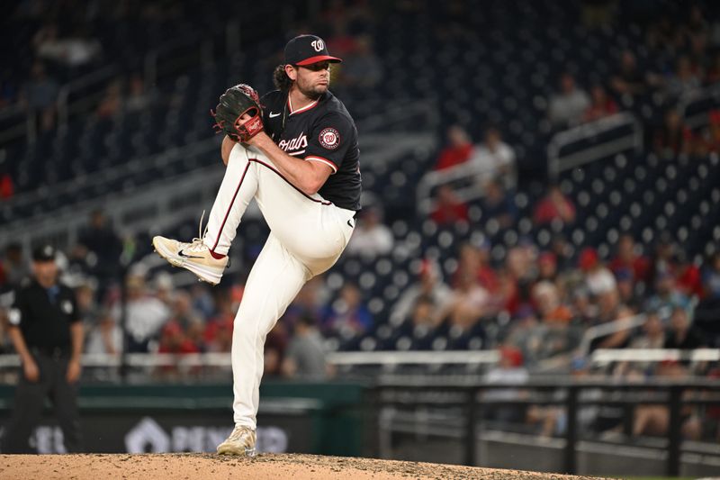 Jul 2, 2024; Washington, District of Columbia, USA; Washington Nationals relief pitcher Kyle Finnegan (67) prepares the throw a pitch against the New York Mets during the ninth inning at Nationals Park. Mandatory Credit: Rafael Suanes-USA TODAY Sports
