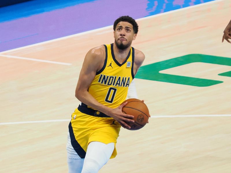 OKLAHOMA CITY, OK - JUNE 8: Tyrese Haliburton #0 of the Indiana Pacers drives to the basket during the game against the Oklahoma City Thunder during Game Two of the 2025 NBA Finals on June 8, 2025 at Paycom Center in Oklahoma City, Oklahoma. NOTE TO USER: User expressly acknowledges and agrees that, by downloading and or using this photograph, User is consenting to the terms and conditions of the Getty Images License Agreement. Mandatory Copyright Notice: Copyright 2025 NBAE (Photo by Ron Hoskins/NBAE via Getty Images)