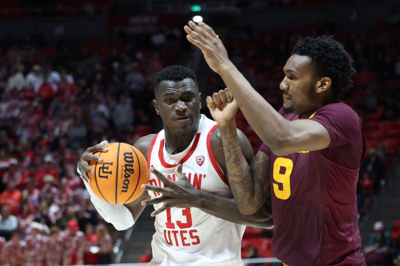 Feb 10, 2024; Salt Lake City, Utah, USA; Utah Utes center Keba Keita (13) posts up against Arizona State Sun Devils center Shawn Phillips Jr. (9) during the second half at Jon M. Huntsman Center. Mandatory Credit: Rob Gray-USA TODAY Sports