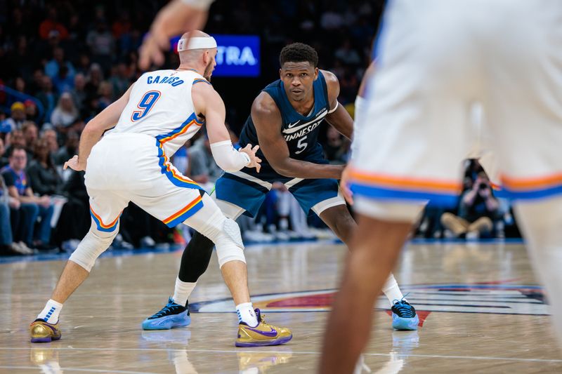 OKLAHOMA CITY, OKLAHOMA - FEBRUARY 24: Anthony Edwards #5 of the Minnesota Timberwolves sets the play around Alex Caruso #9 of the Oklahoma City Thunder during the third quarter at Paycom Center on February 24, 2025 in Oklahoma City, Oklahoma. NOTE TO USER: User expressly acknowledges and agrees that, by downloading and or using this photograph, User is consenting to the terms and conditions of the Getty Images License Agreement. (Photo by William Purnell/Getty Images)