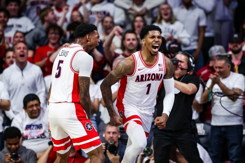 Jan 27, 2025; Tucson, Arizona, USA; Arizona Wildcats guard KJ Lewis (5) celebrates with Arizona Wildcats guard Caleb Love (1) after scoring during the first half against Iowa State at McKale Center. Mandatory Credit: Aryanna Frank-Imagn Images