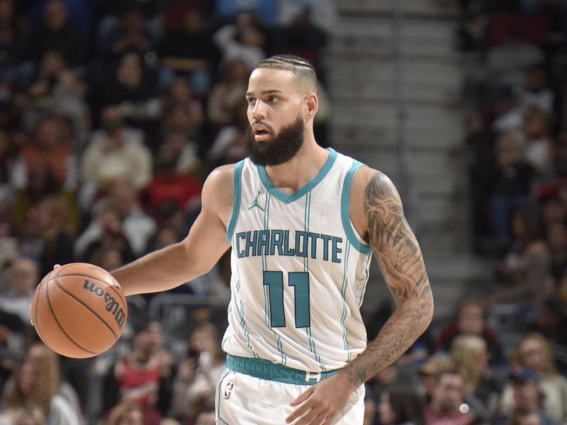 CLEVELAND, OH - NOVEMBER 17: Cody Martin #11 of the Charlotte Hornets dribbles the ball during the game against the Cleveland Cavaliers on November 17, 2024 at Rocket Mortgage FieldHouse in Cleveland, Ohio. NOTE TO USER: User expressly acknowledges and agrees that, by downloading and/or using this Photograph, user is consenting to the terms and conditions of the Getty Images License Agreement. Mandatory Copyright Notice: Copyright 2024 NBAE (Photo by David Liam Kyle/NBAE via Getty Images)