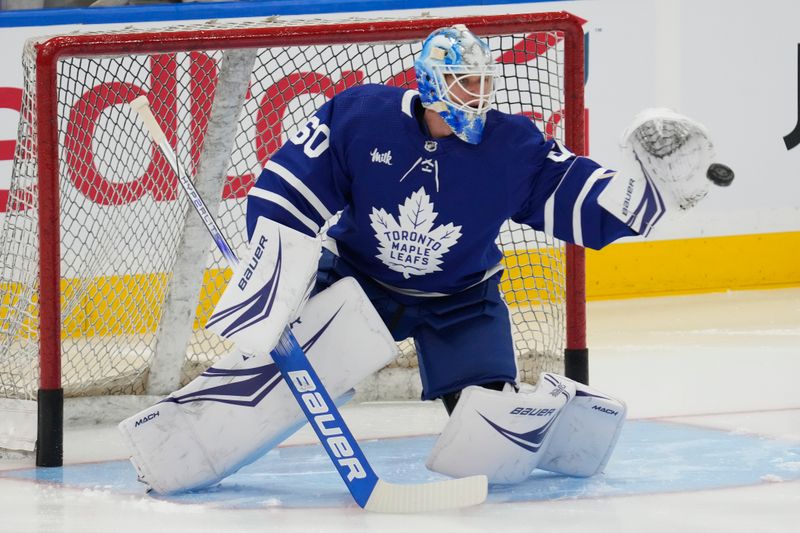 Mar 4, 2024; Toronto, Ontario, CAN; Toronto Maple Leafs goaltender Joseph Woll (60) goes to make a save during warm up before a game against the Boston Bruins at Scotiabank Arena. Mandatory Credit: John E. Sokolowski-USA TODAY Sports