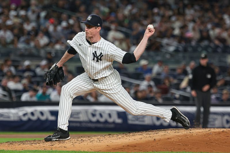 Aug 20, 2024; Bronx, New York, USA; New York Yankees relief pitcher Tim Hill (54) delivers a pitch during the fifth inning against the Cleveland Guardians at Yankee Stadium. Mandatory Credit: Vincent Carchietta-USA TODAY Sports