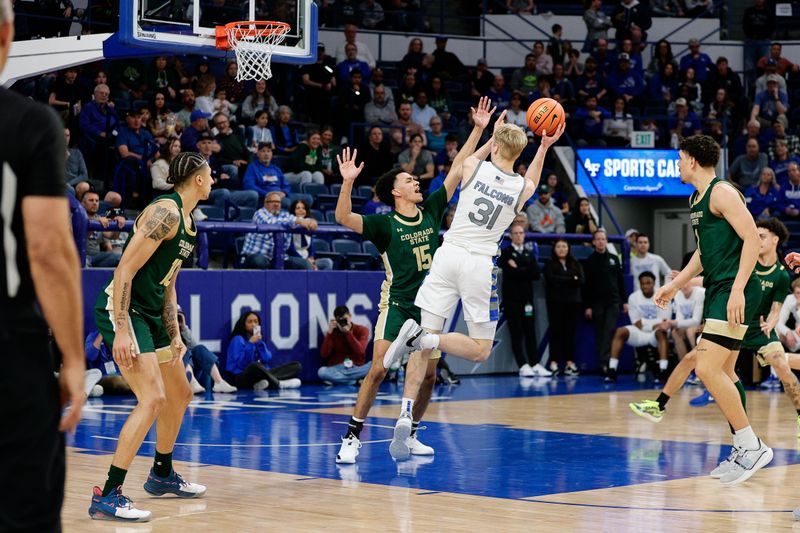 Mar 9, 2024; Colorado Springs, Colorado, USA; Air Force Falcons forward Rytis Petraitis (31) attempts a shot against Colorado State Rams guard Jalen Lake (15) in the second half at Clune Arena. Mandatory Credit: Isaiah J. Downing-USA TODAY Sports