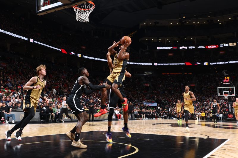 TORONTO, CANADA - FEBRUARY 22: Immanuel Quickley #5 of the Toronto Raptors drives to the basket during the game against the Brooklyn Nets on February 22, 2024 at the Scotiabank Arena in Toronto, Ontario, Canada.  NOTE TO USER: User expressly acknowledges and agrees that, by downloading and or using this Photograph, user is consenting to the terms and conditions of the Getty Images License Agreement.  Mandatory Copyright Notice: Copyright 2024 NBAE (Photo by Vaughn Ridley/NBAE via Getty Images)