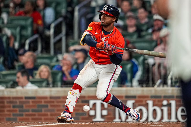 May 30, 2025; Cumberland, Georgia, USA; Atlanta Braves second baseman Ozzie Albies (1) is hit by a pitch against the Boston Red Sox during the seventh inning at Truist Park. Mandatory Credit: Dale Zanine-Imagn Images