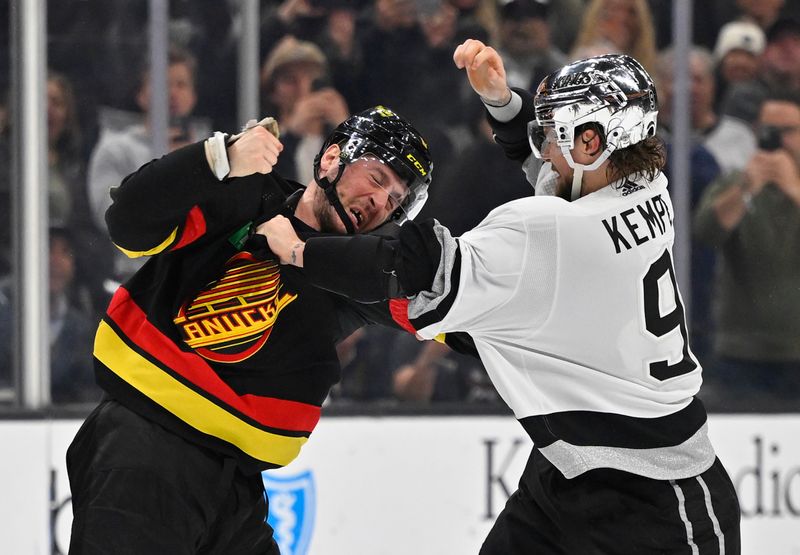 Apr 10, 2023; Los Angeles, California, USA;  Vancouver Canucks center J.T. Miller (9) and Los Angeles Kings right wing Adrian Kempe (9) fight in the second period at Crypto.com Arena. Mandatory Credit: Jayne Kamin-Oncea-USA TODAY Sports