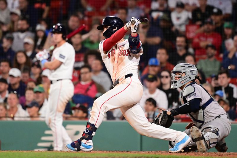 iJun 16, 2024; Boston, Massachusetts, USA; Boston Red Sox shortstop David Hamilton (70) hits an RBI single against the New York Yankees during the eighth inning at Fenway Park. Mandatory Credit: Eric Canha-USA TODAY Sports