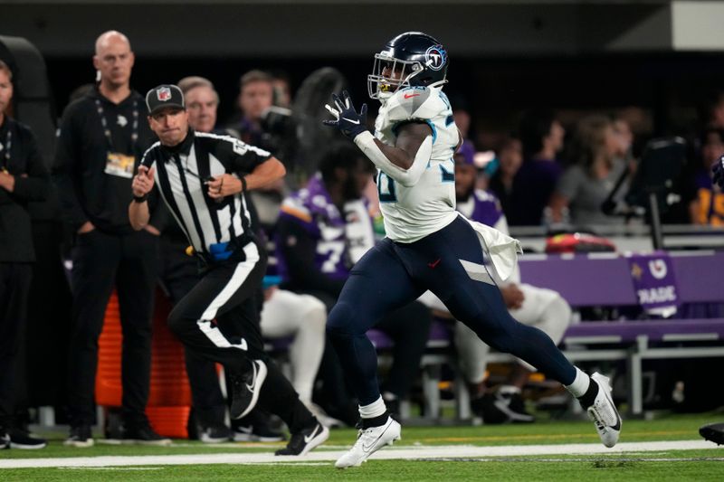 Tennessee Titans running back Julius Chestnut (36) carries the ball up field during the second half of an NFL football game against the Minnesota Vikings, Saturday, Aug. 19, 2023, in Minneapolis. (AP Photo/Charlie Neibergall)