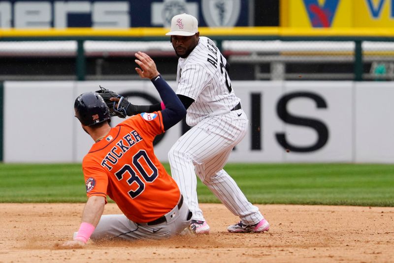 May 14, 2023; Chicago, Illinois, USA; Houston Astros right fielder Kyle Tucker (30) is safe at second base with a double as Chicago White Sox second baseman Hanser Alberto (26) takes a late throw during the eighth inning at Guaranteed Rate Field. Mandatory Credit: David Banks-USA TODAY Sports