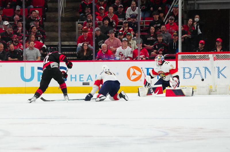 Mar 14, 2024; Raleigh, North Carolina, USA; Carolina Hurricanes center Evgeny Kuznetsov (92) scores a goal past Florida Panthers goaltender Sergei Bobrovsky (72) during the second period at PNC Arena. Mandatory Credit: James Guillory-USA TODAY Sports