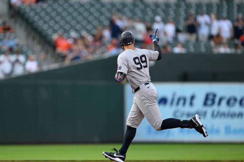 Apr 30, 2025; Baltimore, Maryland, USA; New York Yankees outfielder Aaron Judge (99) hits a home run during the first inning against the Baltimore Orioles at Oriole Park at Camden Yards. Mandatory Credit: Reggie Hildred-Imagn Images