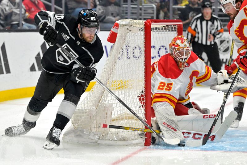 Apr 11, 2024; Los Angeles, California, USA; Calgary Flames goaltender Jacob Markstrom (25) makes a save on a shot by Los Angeles Kings center Pierre-Luc Dubois (80) in the second period at Crypto.com Arena. Mandatory Credit: Jayne Kamin-Oncea-USA TODAY Sports