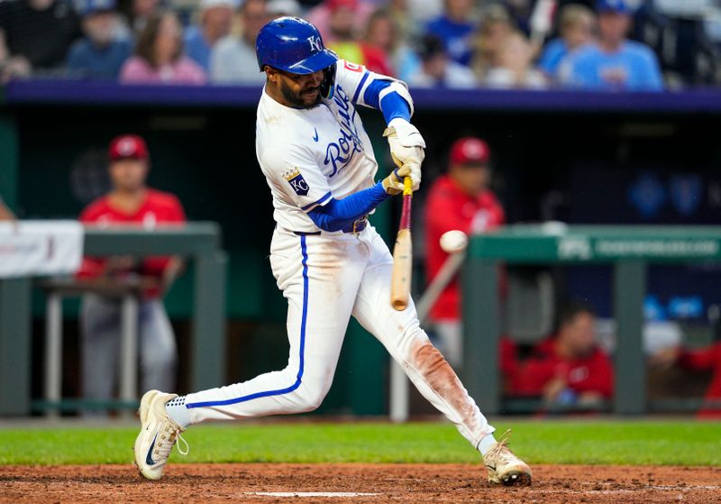 May 28, 2025; Kansas City, Missouri, USA; Kansas City Royals designated hitter Maikel Garcia (11) hits a single during the sixth inning against the Cincinnati Reds at Kauffman Stadium. Mandatory Credit: Jay Biggerstaff-Imagn Images