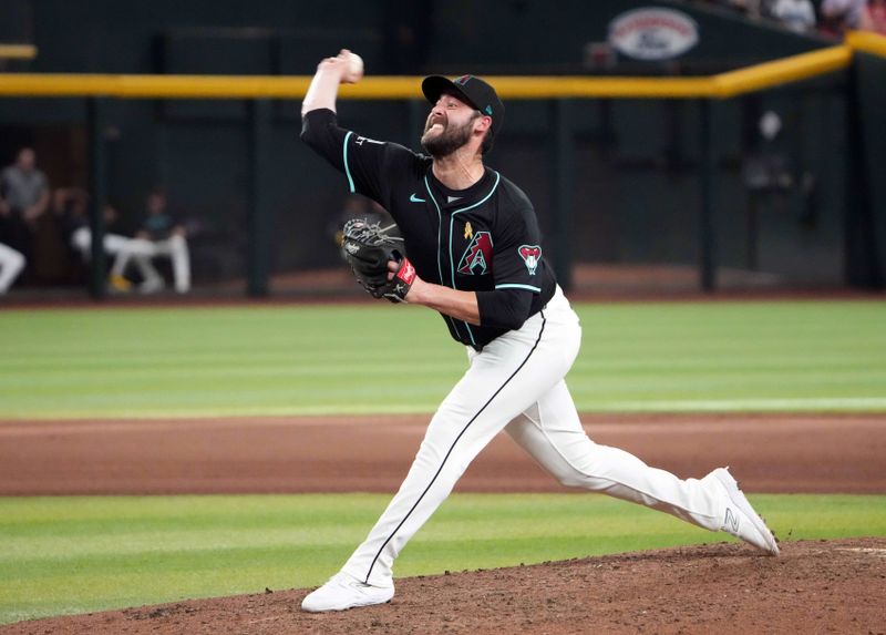 Sep 1, 2024; Phoenix, Arizona, USA; Arizona Diamondbacks pitcher Dylan Floro (55) pitches against the Los Angeles Dodgers during the ninth inning at Chase Field. Mandatory Credit: Joe Camporeale-USA TODAY Sports