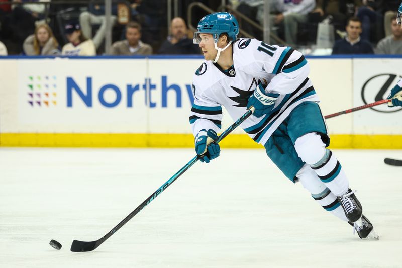 Oct 23, 2025; New York, New York, USA;  San Jose Sharks center Ty Dellandrea (10) controls the puck in the third period against the New York Rangers at Madison Square Garden. Mandatory Credit: Wendell Cruz-Imagn Images