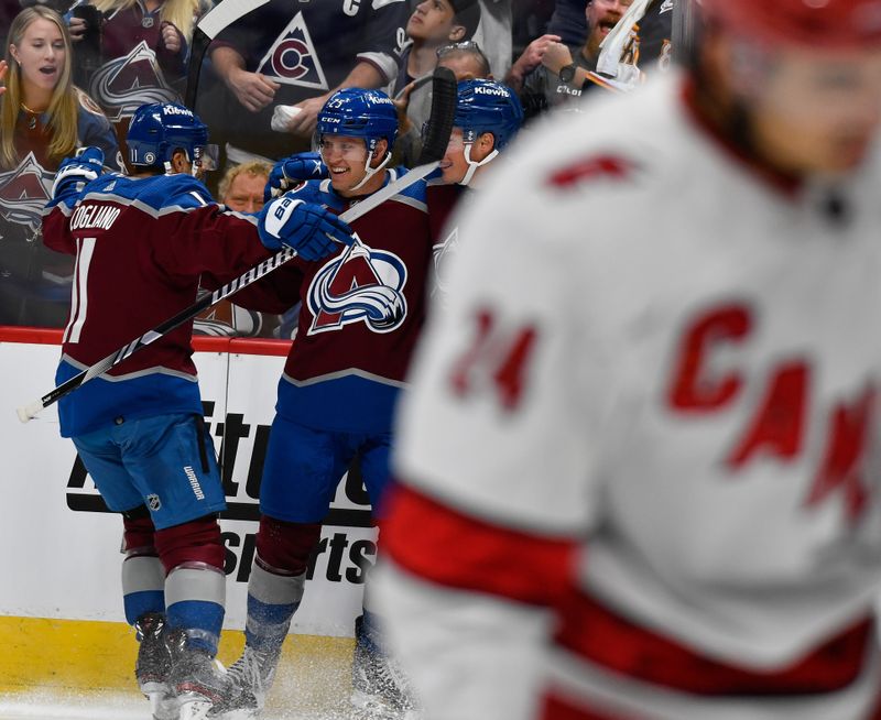 Oct 21, 2023; Denver, Colorado, USA;  Colorado Avalanche right wing Logan O'Connor (25) is congratulated by Colorado Avalanche center Andrew Cogliano (11) after his short handed goal in the second period against the Carolina Hurricanes at Ball Arena. Mandatory Credit: John Leyba-USA TODAY Sports