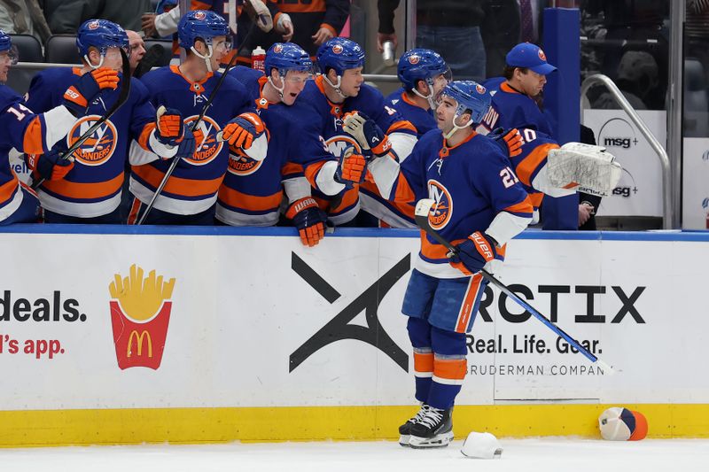 Mar 2, 2024; Elmont, New York, USA; New York Islanders center Kyle Palmieri (21) celebrates his natural hat trick against the Boston Bruins with teammates during the first period at UBS Arena. Mandatory Credit: Brad Penner-USA TODAY Sports