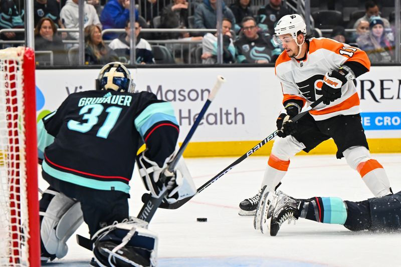 Feb 16, 2023; Seattle, Washington, USA; Philadelphia Flyers right wing Travis Konecny (11) shoots against Seattle Kraken goaltender Philipp Grubauer (31) during the second period at Climate Pledge Arena. Mandatory Credit: Steven Bisig-USA TODAY Sports