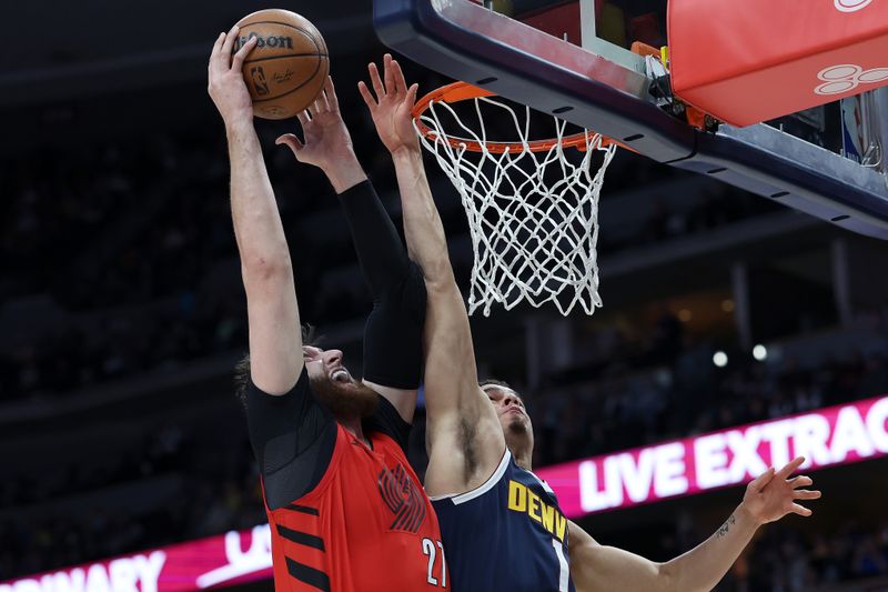 DENVER, COLORADO - JANUARY 17: Jusuf Nurkic #27 of the Portland Trail Blazers goes to the basket against Michael Porter Jr. #1 of the Denver Nuggets first quarter at Ball Arena on January 17, 2023 in Denver, Colorado. NOTE TO USER: User expressly acknowledges and agrees that, by downloading and/or using this photograph, User is consenting to the terms and conditions of the Getty Images License Agreement. (Photo by Matthew Stockman/Getty Images)