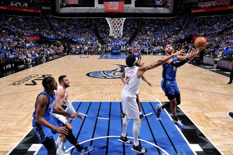 ORLANDO, FL - APRIL 27: Jalen Suggs #4 of the Orlando Magic drives to the basket during the game against the Cleveland Cavaliers during Round 1 Game 4 of the 2024 NBA Playoffs on April 27, 2024 at the Kia Center in Orlando, Florida. NOTE TO USER: User expressly acknowledges and agrees that, by downloading and or using this photograph, User is consenting to the terms and conditions of the Getty Images License Agreement. Mandatory Copyright Notice: Copyright 2024 NBAE (Photo by Fernando Medina/NBAE via Getty Images)