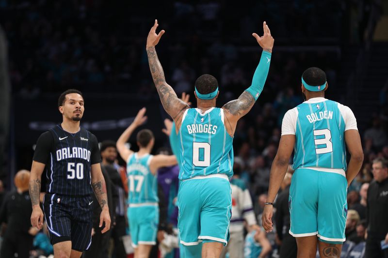 CHARLOTTE, NC - APRIL 5:  Miles Bridges #0  and Marques Bolden #3 of the Charlotte Hornets react during the game against the Orlando Magic on April 5, 2024 at Spectrum Center in Charlotte, North Carolina. NOTE TO USER: User expressly acknowledges and agrees that, by downloading and or using this photograph, User is consenting to the terms and conditions of the Getty Images License Agreement.  Mandatory Copyright Notice:  Copyright 2024 NBAE (Photo by Brock Williams-Smith/NBAE via Getty Images)