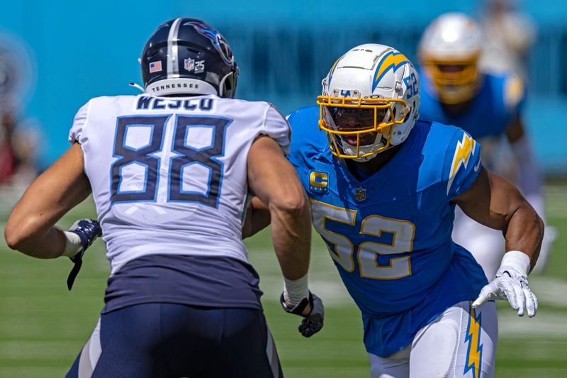 Los Angeles Chargers linebacker Khalil Mack (52) rushes as he's blocked by Tennessee Titans tight end Trevon Wesco (88) during their NFL football game Sunday, Sept. 17, 2023, in Nashville, Tenn. (AP Photo/Wade Payne)