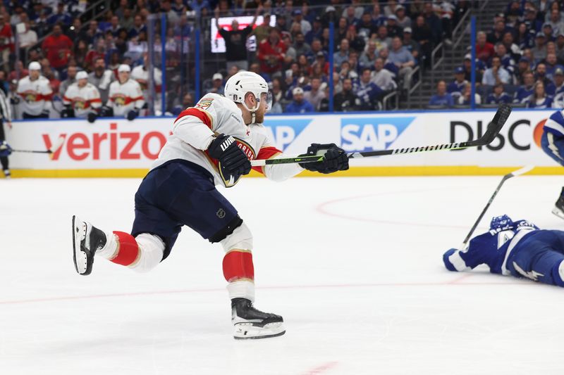 Apr 30, 2025; Tampa, Florida, USA; Florida Panthers center Sam Bennett (9) shoots and scores on goal against the Tampa Bay Lightning during the second period of game five of the first round of the 2025 Stanley Cup Playoffs at Amalie Arena. Mandatory Credit: Kim Klement Neitzel-Imagn Images