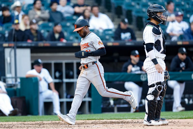 May 26, 2024; Chicago, Illinois, USA; Baltimore Orioles outfielder Cedric Mullins (31) scores against the Chicago White Sox during the ninth inning at Guaranteed Rate Field. Mandatory Credit: Kamil Krzaczynski-USA TODAY Sports