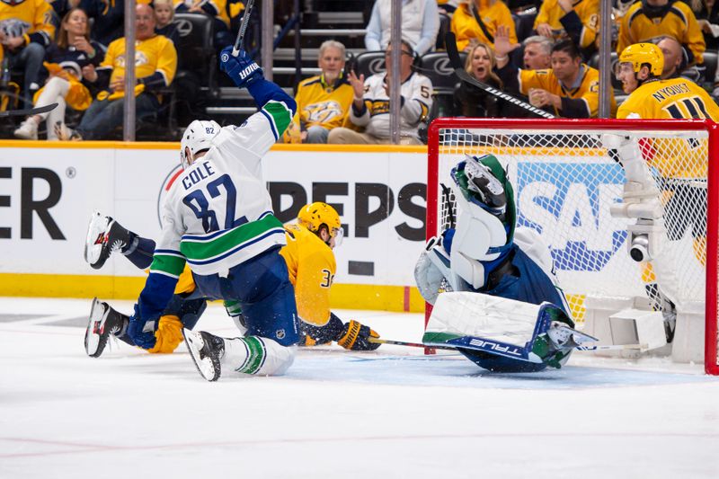 Apr 26, 2024; Nashville, Tennessee, USA; Vancouver Canucks goaltender Casey DeSmith (29) blocks the shot of Nashville Predators left wing Cole Smith (36) during the third period in game three of the first round of the 2024 Stanley Cup Playoffs at Bridgestone Arena. Mandatory Credit: Steve Roberts-USA TODAY Sports