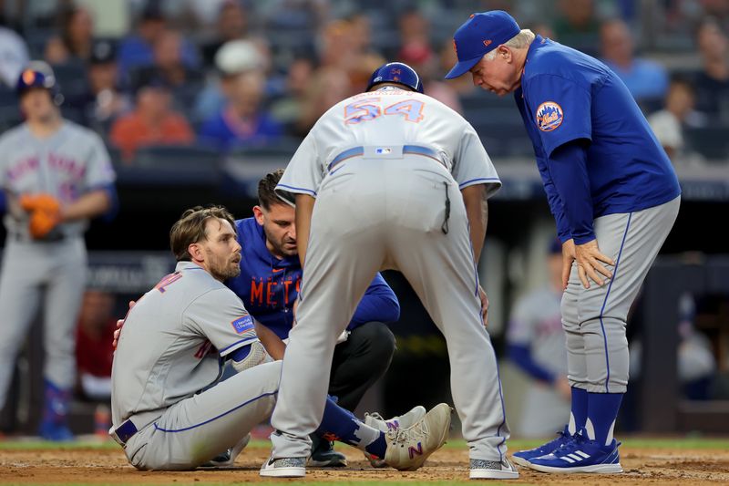 Jul 26, 2023; Bronx, New York, USA; New York Mets right fielder Jeff McNeil (1) is evaluated by manager Buck Showalter (11) and first base coach Wayne Kirby (54) after being hit by a pitch during the fourth inning against the New York Yankees at Yankee Stadium. Mandatory Credit: Brad Penner-USA TODAY Sports