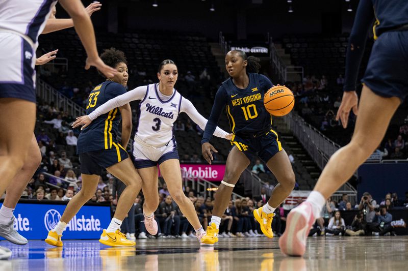 Mar 9, 2024; Kansas City, MO, USA; West Virginia Mountaineers guard Jordan Harrison (10) handles the ball while guarded by Kansas State Wildcats guard Jaelyn Glenn (3) during the first half at T-Mobile Center. Mandatory Credit: Amy Kontras-USA TODAY Sports