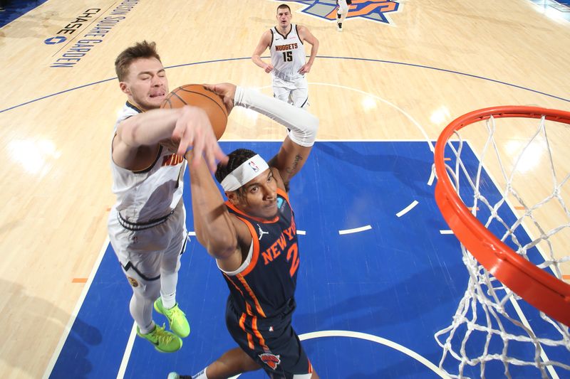 NEW YORK, NY - JANUARY 25: Miles McBride #2 of the New York Knicks dunks the ball during the game against the Denver Nuggets on January 25, 2024 at Madison Square Garden in New York City, New York.  NOTE TO USER: User expressly acknowledges and agrees that, by downloading and or using this photograph, User is consenting to the terms and conditions of the Getty Images License Agreement. Mandatory Copyright Notice: Copyright 2024 NBAE  (Photo by Nathaniel S. Butler/NBAE via Getty Images)