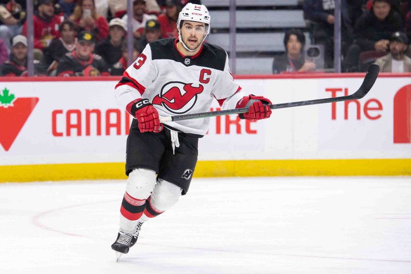 Oct 17, 2024; Ottawa, Ontario, CAN; New Jersey Devils center Nico Hischier (13) skates in the second period against the Ottawa Senators at the Canadian Tire Centre. Mandatory Credit: Marc DesRosiers-Imagn Images